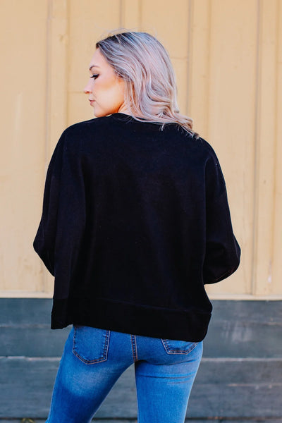 GLITTERY HOLLY JOLLY ON BLACK CROP SWEATSHIRT